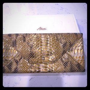 Embossed snakeskin clutch wallet by Abas